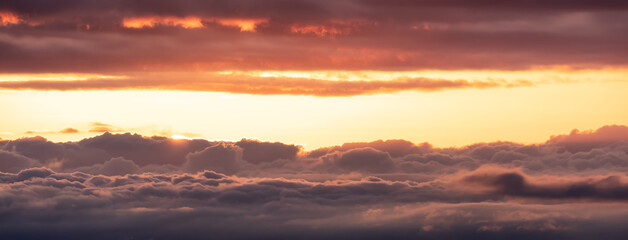 Aerial Cloudscape during morning Sunrise Sky. British Columbia, Canada. Nature Background