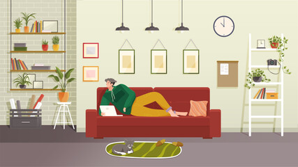 Young man sits on sofa and work from home with laptop, relaxing and surfing Internet. Cat lies on mat next to owner. Concept living room with sofa, plants, man, lamps. Person indoor job remote work