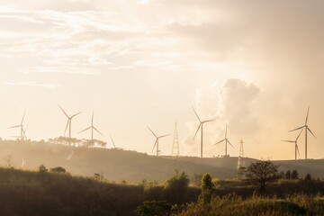 Clean and renewable energy to reduce carbon emissions concept, many wind turbines generating...