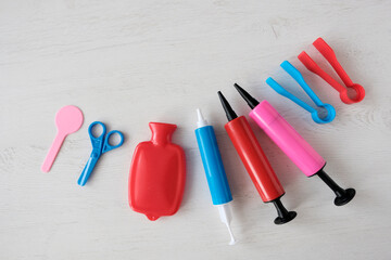 Medical children's instruments on a light table. Doctor's first aid kit. Syringes, pills,...