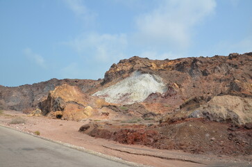 view from the street to colorful rocks at Hormuz island, Iran