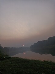 sunset over the river in india with great atmosphere and fresh air natural photography