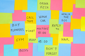 Multicolored sticky paper notes with various messages