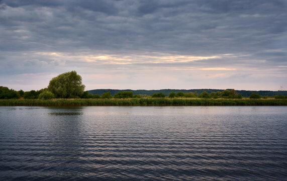 Beautiful sunset over the river. Summer landscape. Poland, Europe.
