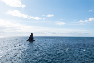 Beautiful Atlantic ocean with stone cliff and blue sky on Madeira