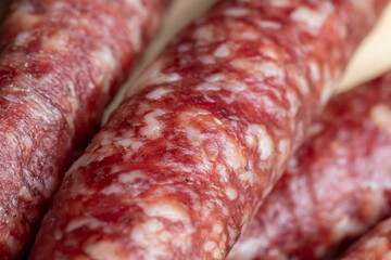 Dried veal sausage during slicing