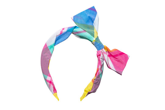 Fashionable hair band. Close-up of an colorful fabric headband with bow for girls isolated on a white background. Clipping path.