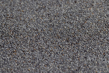 Poppy seeds on the table close up