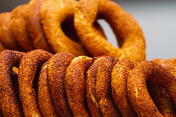 Traditional turkish bagels on a  showcase .  Sesame encrusted pastry