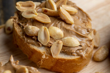 Peanut paste on a soft wheat baguette