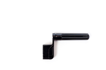 Plastic guitar string winders in black, shot on a white background.