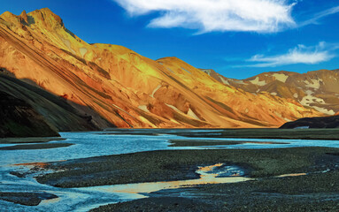 Beuatiful icelandic landscape in morning sun, Tungnaa river with low water level, red mountains -...