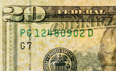 a close-up of twenty American dollars transparent in the light