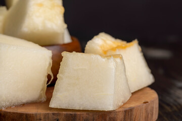 Ripe yellow melon cut into pieces and portions