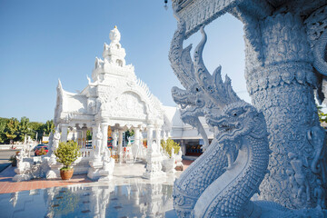 White pavilion with blue sky background. at Wat Ming Muang temple, Nan province, Thailand. - 569679234