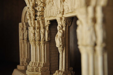 miniature of the portal of a Spanish church, focus on the side column