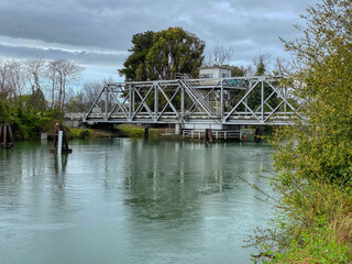 Fototapeta premium A small bridge across the river, Delta, California, USA