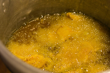 video of preparation of chicken broaster in abundant oil. Food preparation concept.