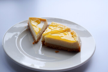  half eaten a slice of cheese cake 