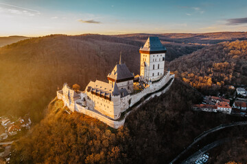 Aerial view of gothic Royal Karlstejn Castle with Czech crown jewels,Czech Republic.Most popular Czech castle at sunset.Amazing historical monument in central Europe.Czech landmark,tourist attraction © Eva