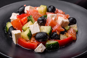 Delicious fresh Greek salad with olives, tomatoes, cucumbers and feta cheese