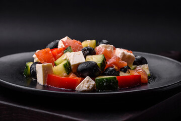Delicious fresh Greek salad with olives, tomatoes, cucumbers and feta cheese