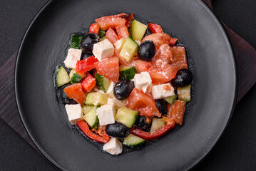 Delicious fresh Greek salad with olives, tomatoes, cucumbers and feta cheese