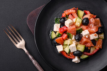 Delicious fresh Greek salad with olives, tomatoes, cucumbers and feta cheese