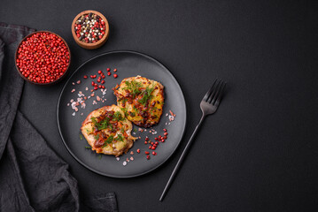 Meat baked in the oven with pineapple, tomatoes, cheese, spices and herbs