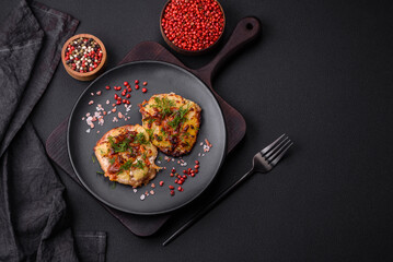 Meat baked in the oven with pineapple, tomatoes, cheese, spices and herbs