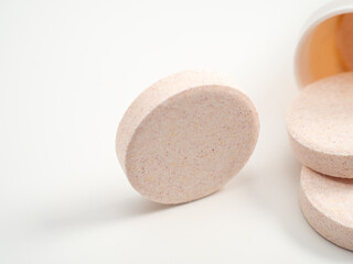 Effervescent multivitamin tablets on a white background. Close-up.