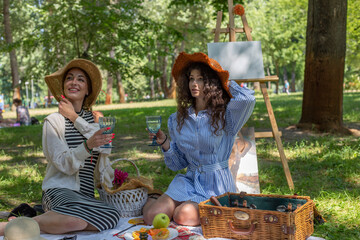 Art picnic in spring drinking wine, laughing, taking pictures on polaroid and having a great time...