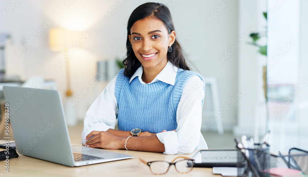 Poster Portrait of a young entrepreneur networking with clients online using her laptop. One happy female corporate intern browsing the internet and typing and sending emails for her manager