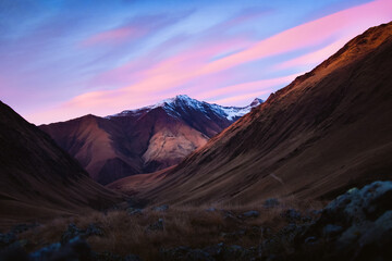 Beautiful Juta valley hiking route with scenic mountain snowy peak background. Kazbegi national park landscape