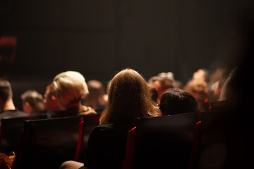 audience watching a play at the theater