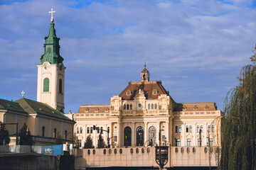 Naklejka premium Travel to Oradea, Romania. Highlight the significant religious sites of Oradea, including churches, synagogues, and temples. stunning Art Nouveau architecture of Oradea