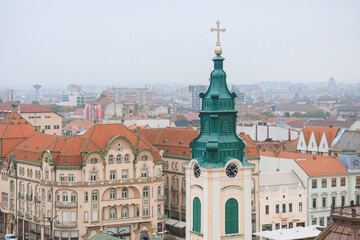 Fototapeta na wymiar Oradea culture and history. Highlight the historic city centers of Oradea, with their charming cobblestone streets, historic buildings, and vibrant local life, churches, synagogues, and temples