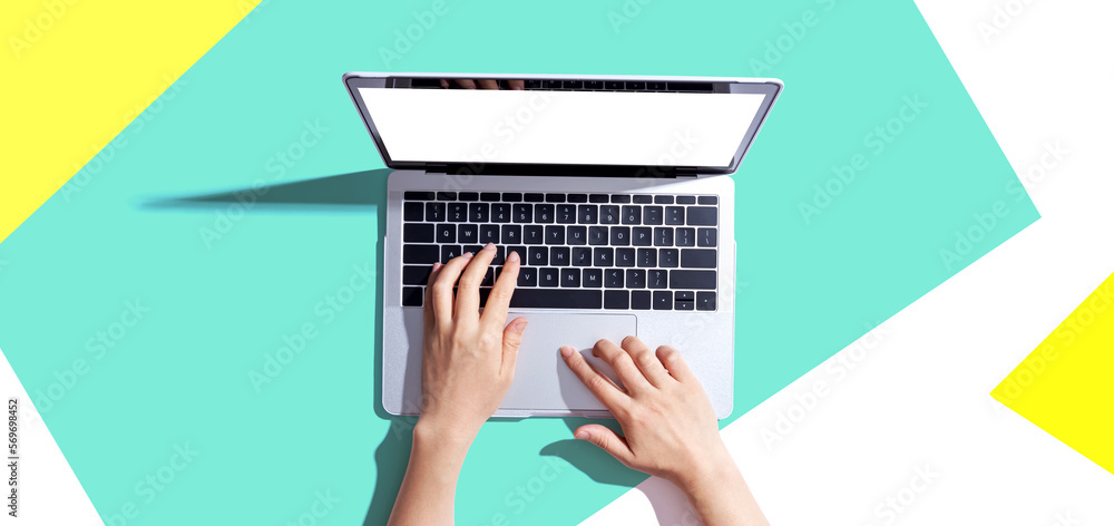 Poster person using a laptop computer from above