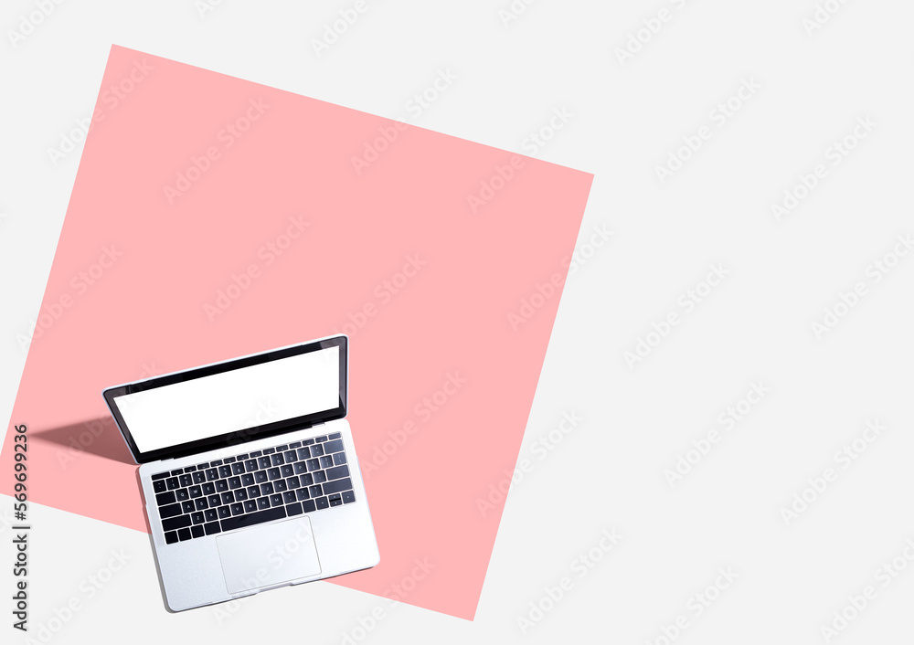 Poster laptop computer with shadow from above - flat lay