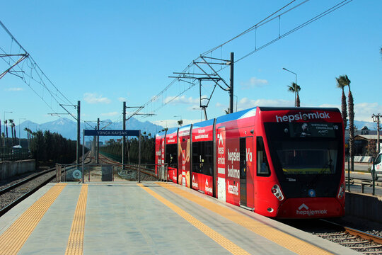 Antalya, Turkey - February 7, 2023: Antray light tram, a popular mode of transportation in Antalya, stands at Yonca Kavsak station in Muratpasa district.