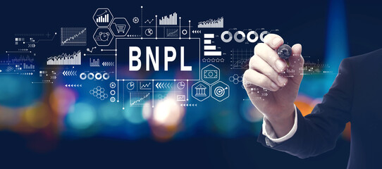 BNPL - Buy Now Pay Later theme with businessman in a city at night