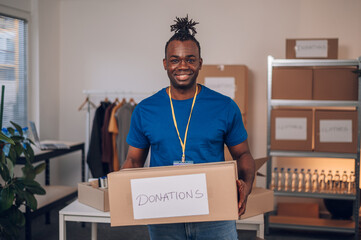 African american man volunteer working in a charity donation center