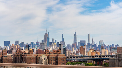 New York Midtown skyline seen from the Brooklyn Bridge with empire state building, chrysler...