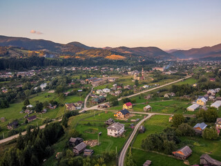 Aerial vIew of city Verhovyna by drone. Summer Ukraine Ivano Frankivsk region, West Ukraine. Carpatian mountains.
