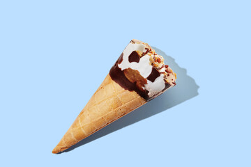 vanilla ice cream with cone on blue pastel background