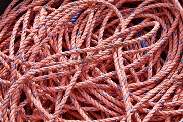 Coil of red rope close up outside
