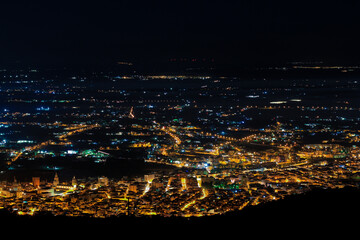 Aerial city panorama at night, city lights at night, skyline, Comiso / Sicily.