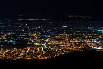 Aerial city panorama at night, city lights at night, skyline, Comiso / Sicily.