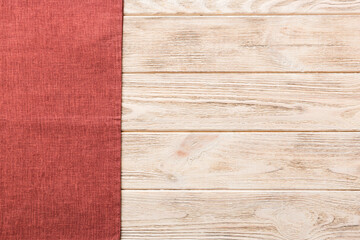 top view with red empty kitchen napkin isolated on table background. Folded cloth for mockup with...