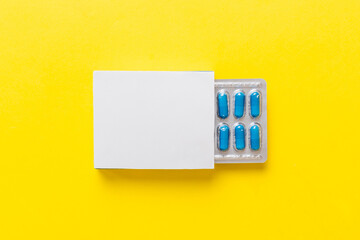 Blank White Product Package Box Mock-up. Open blank medicine drug box with blue pills blister top view - obrazy, fototapety, plakaty